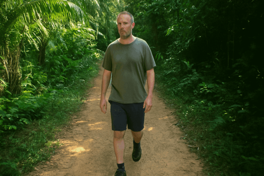 Darren walking along a shaded jungle trail in Thailand during his rehab stay.
