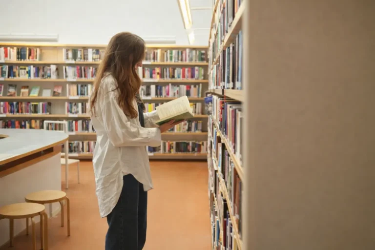 person browsing books in a library representing addiction concept index and structured knowledge exploration