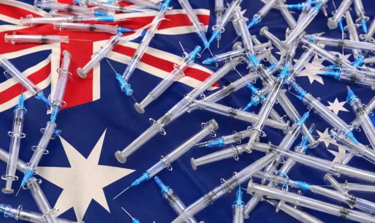 Syringes placed across an Australian flag symbolizing the growing impact of ice and methamphetamine addiction in Australia