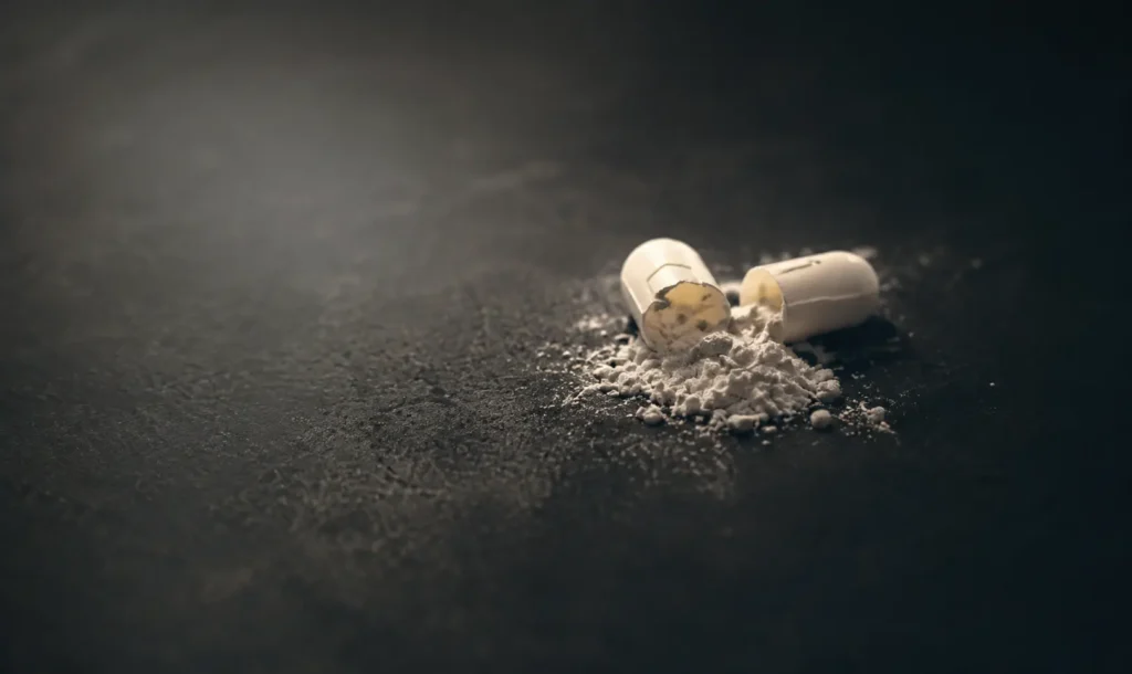 Opened capsule with powder, illustrating most addictive drugs treated in rehab