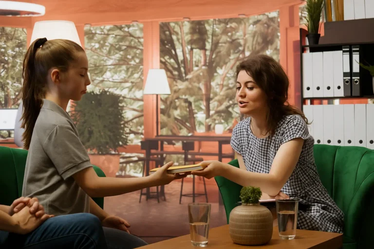 Therapist supporting a young woman during counseling — family healing and addiction treatment at Siam Rehab