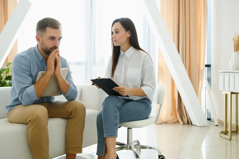 Therapist providing supportive guidance to an anxious client during an individual session